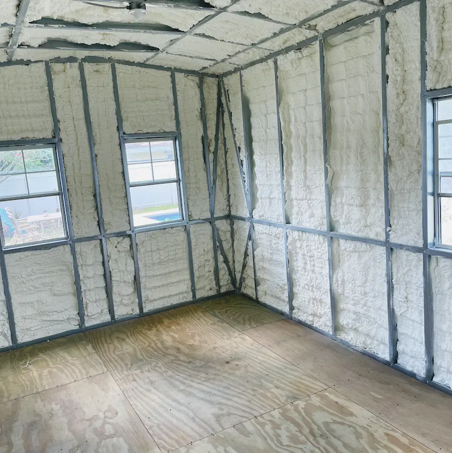 Closed-cell spray foam insulation applied to wall cavities in a residential project in Putnam